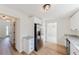 Spacious kitchen boasts stainless steel refrigerator and ample cabinet space at 9482 Deer Crossing Ln, Jonesboro, GA 30236