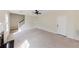 Large living room with fireplace, staircase and doors to other rooms at 9482 Deer Crossing Ln, Jonesboro, GA 30236