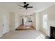 Living room showing seamless transition to kitchen and dining area at 9482 Deer Crossing Ln, Jonesboro, GA 30236