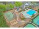 An aerial view of community amenities includes a playground, pool, basketball and tennis courts at 973 Duncan Ter, Canton, GA 30115