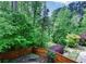 Lush backyard with a wooden fence, mature trees, and manicured landscaping, providing a private retreat at 973 Duncan Ter, Canton, GA 30115