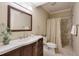 Bathroom with a white countertop, dark wood cabinets, a shower, and marble floors at 973 Duncan Ter, Canton, GA 30115