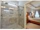 Modern bathroom showcasing a frameless glass shower and view into main bedroom at 973 Duncan Ter, Canton, GA 30115