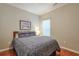 Guest bedroom featuring hardwood floors, a comfortable bed, and a window with natural light at 973 Duncan Ter, Canton, GA 30115