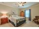 Cozy bedroom with carpet, a ceiling fan, a wooden armoire, and blue curtains at 973 Duncan Ter, Canton, GA 30115