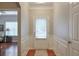 Bright entryway featuring a stylish door, wood floors, and elegant molding at 973 Duncan Ter, Canton, GA 30115