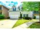 Charming home features a two-car garage, manicured lawn, and inviting curb appeal at 973 Duncan Ter, Canton, GA 30115