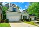 Charming home with a two-car garage, well-manicured lawn, and attractive curb appeal at 973 Duncan Ter, Canton, GA 30115