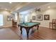 Game room with a pool table, recessed lights, dark wood floors, and backyard access at 973 Duncan Ter, Canton, GA 30115