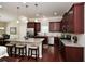 Modern kitchen featuring granite countertops, stainless steel appliances, and a large island with seating at 973 Duncan Ter, Canton, GA 30115