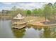 Scenic view of the lake with a covered pier, walking path and seating at 973 Duncan Ter, Canton, GA 30115