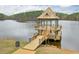 A close-up of the lake pier featuring two levels and covered roof at 973 Duncan Ter, Canton, GA 30115