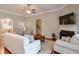 Inviting living room with a fireplace, hardwood floors, and neutral decor, offering a comfortable and stylish space at 973 Duncan Ter, Canton, GA 30115
