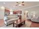 Bright and airy living room with modern decor, hardwood floors, and an open layout connected to the kitchen at 973 Duncan Ter, Canton, GA 30115