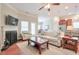 Cozy living room featuring a fireplace, comfortable seating, and an open layout leading to the kitchen at 973 Duncan Ter, Canton, GA 30115