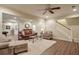 Spacious living room offering wood floors, a fan, and an open floor plan at 973 Duncan Ter, Canton, GA 30115