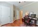Cozy home office features hardwood floors, white trim, and a modern desk setup at 973 Duncan Ter, Canton, GA 30115