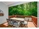 Outdoor dining area on wooden deck overlooking lush green trees and landscaping at 973 Duncan Ter, Canton, GA 30115