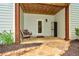Lower-level patio area with stone pathway, seating, and utility storage closet at 973 Duncan Ter, Canton, GA 30115