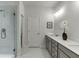 Modern bathroom featuring a glass shower, elegant countertops, and fixtures at 1242 Ainsworth Aly # 40, Sugar Hill, GA 30518