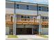 View of new construction townhomes featuring rear decks and garages at 1242 Ainsworth Aly # 40, Sugar Hill, GA 30518