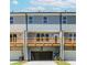 View of new construction townhomes featuring rear decks and garages at 1242 Ainsworth Aly # 40, Sugar Hill, GA 30518