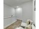 Upstairs hallway landing featuring hardwood floors, comfortable seating, and elegant lighting, providing a relaxing atmosphere at 1242 Ainsworth Aly # 40, Sugar Hill, GA 30518