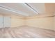 Brightly lit basement with light wood flooring, providing a versatile living space at 3580 Bulloch Lake Rd, Loganville, GA 30052