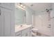 Well-lit bathroom features a shower/tub combo, single sink vanity, and ample storage space at 3580 Bulloch Lake Rd, Loganville, GA 30052
