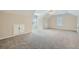 Spacious bonus room featuring vaulted ceilings, plush carpet, and natural light at 3580 Bulloch Lake Rd, Loganville, GA 30052