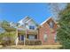 Beautiful two-story home featuring a brick facade and well-maintained landscaping at 3580 Bulloch Lake Rd, Loganville, GA 30052