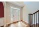 Welcoming foyer with tile and hardwood flooring and staircase at 3580 Bulloch Lake Rd, Loganville, GA 30052