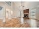 Open living room with high ceilings, brick fireplace, and hardwood floors at 3580 Bulloch Lake Rd, Loganville, GA 30052