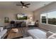 Bright living room featuring hardwood floors, a ceiling fan, a large window, and modern furniture at 360 Winston Cir, Canton, GA 30114