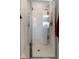 Bright shower stall with chrome frame, white tile, and built-in shelving for toiletries at 360 Winston Cir, Canton, GA 30114