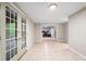 Bright basement area with tile flooring, glass doors to the outside, and easy access to another room at 4442 Freeman Rd, Marietta, GA 30062