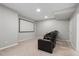 Finished basement featuring a comfortable home theater setup with a large screen and reclining seats at 4442 Freeman Rd, Marietta, GA 30062