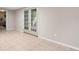 Finished basement with tiled floors and access to the outside through elegant glass doors at 4442 Freeman Rd, Marietta, GA 30062