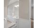 Neutral bathroom with a tile floor, white cabinets, and a large mirror and modern lighting at 4442 Freeman Rd, Marietta, GA 30062