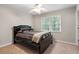 Carpeted bedroom features a ceiling fan and window with natural light at 4442 Freeman Rd, Marietta, GA 30062