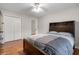 Bedroom features hardwood floors, a closet, and a dark wood headboard bed at 4442 Freeman Rd, Marietta, GA 30062