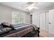 Carpeted bedroom features a double closet and a window providing ample natural light at 4442 Freeman Rd, Marietta, GA 30062