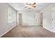 Carpeted bedroom features a large window, neutral paint, and multiple doors at 4442 Freeman Rd, Marietta, GA 30062
