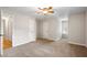 Carpeted bedroom with closet and ceiling fan offering ample storage and comfort at 4442 Freeman Rd, Marietta, GA 30062