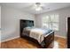 Bedroom features hardwood floors, a window and a dark wood headboard bed at 4442 Freeman Rd, Marietta, GA 30062