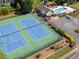Overhead view of community amenities with a pool and tennis courts, promoting an active lifestyle at 4442 Freeman Rd, Marietta, GA 30062