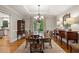 Traditional dining room with hardwood floors, chandelier, and large window overlooking the yard at 4442 Freeman Rd, Marietta, GA 30062