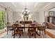 Traditional dining area with area rug, buffet, and access to the living room at 4442 Freeman Rd, Marietta, GA 30062