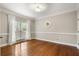 Empty room with hardwood flooring, crown molding and ample natural light at 4442 Freeman Rd, Marietta, GA 30062