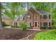 Attractive brick home with dormer windows, black shutters, and well-maintained landscaping at 4442 Freeman Rd, Marietta, GA 30062